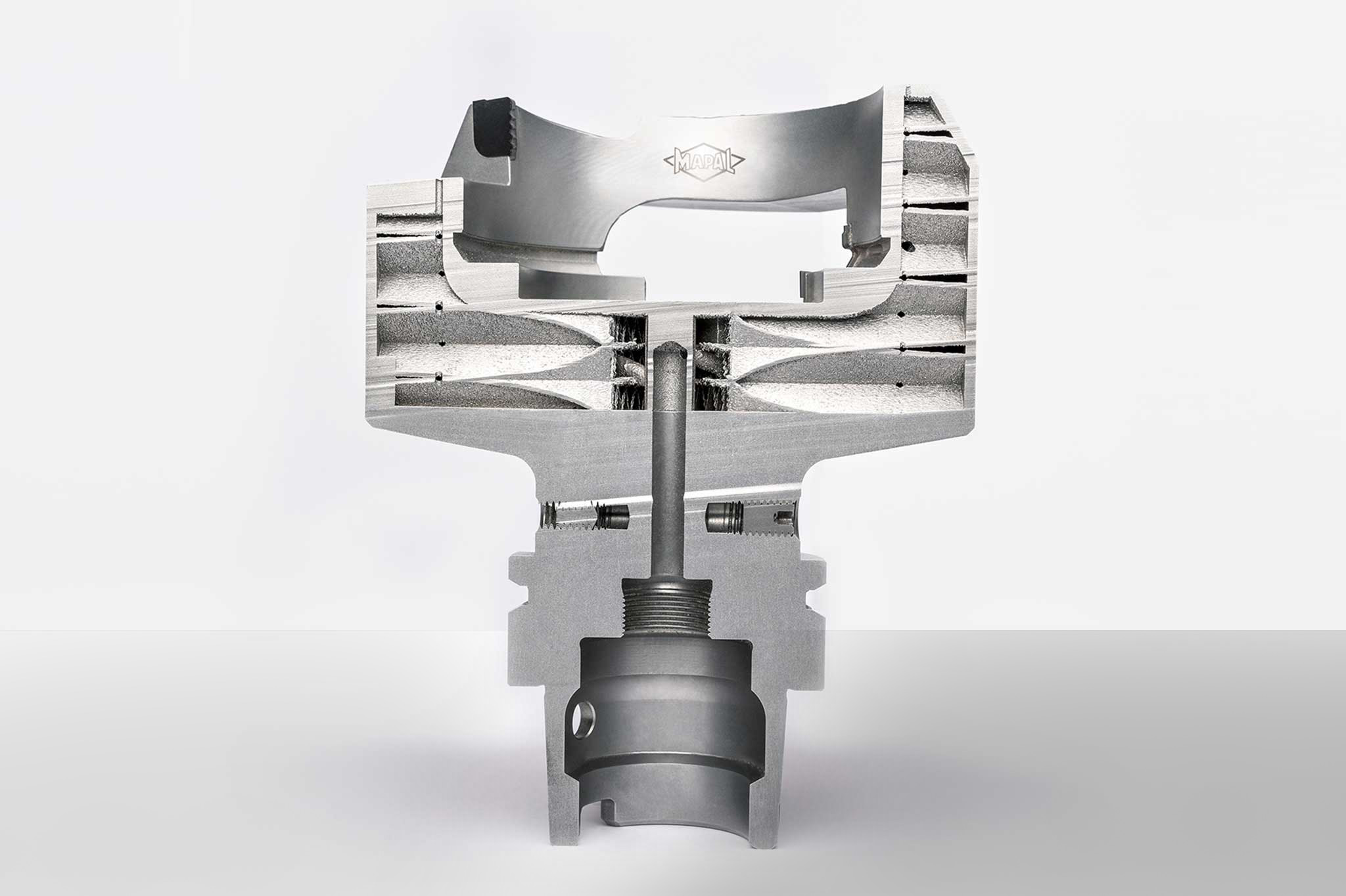 A cut of the bell tool. Inside, the honeycomb structure of the tool area, which is 3D printed.