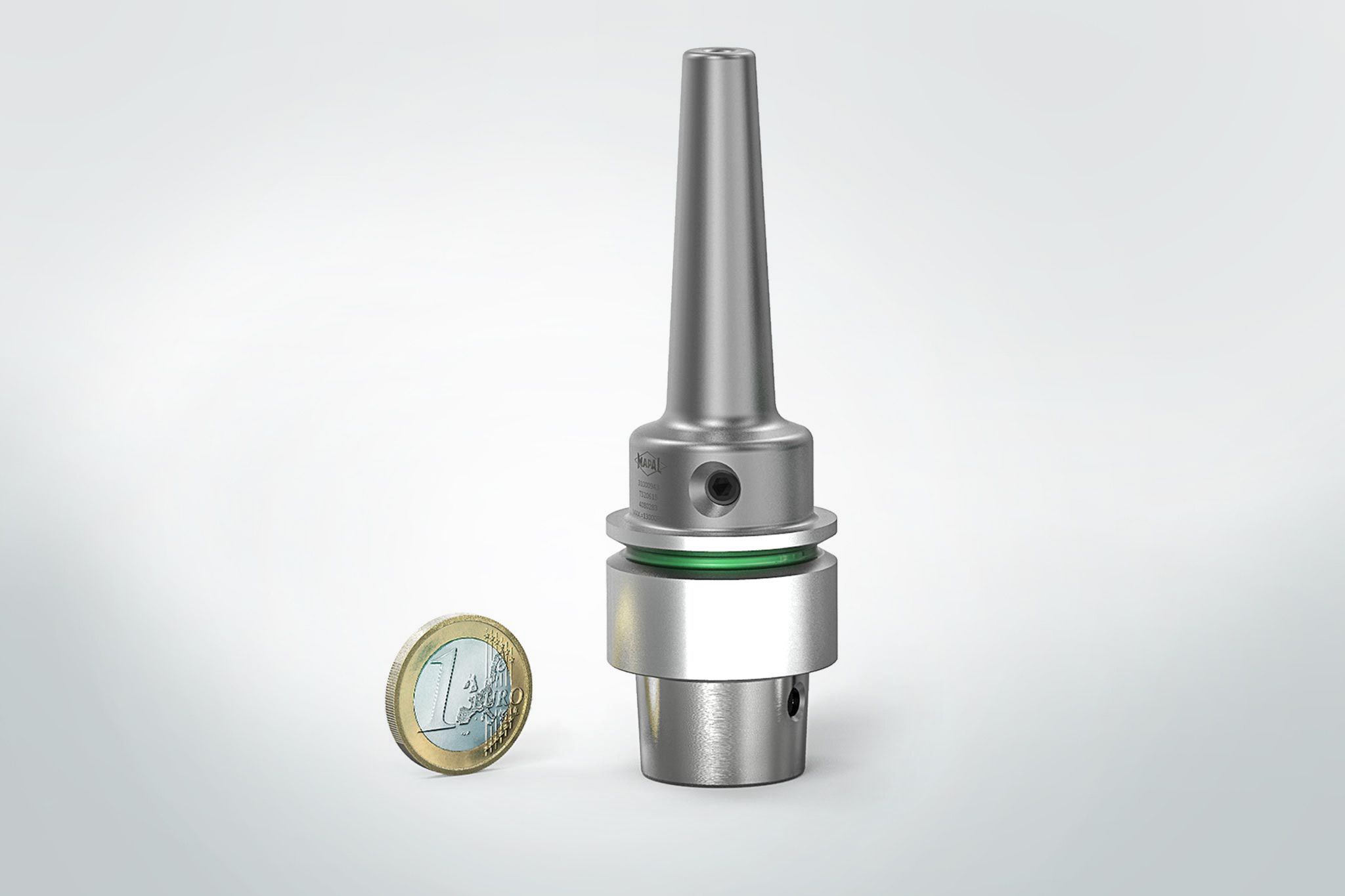 The small chuck is shown next to a 1 euro coin.
