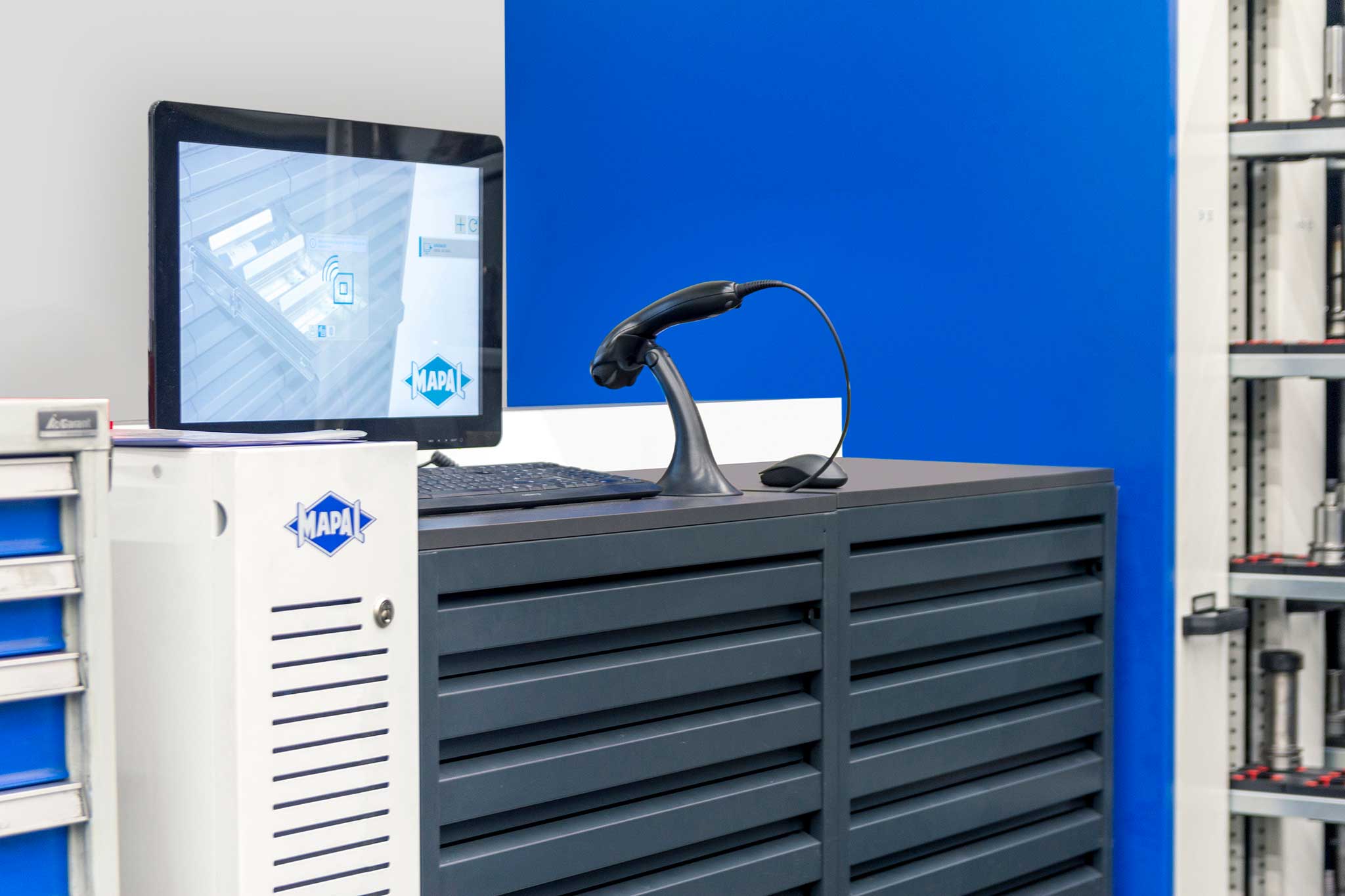 A UNIBASE-M tool dispensing system with computer unit, cabinets, monitor and scanner.